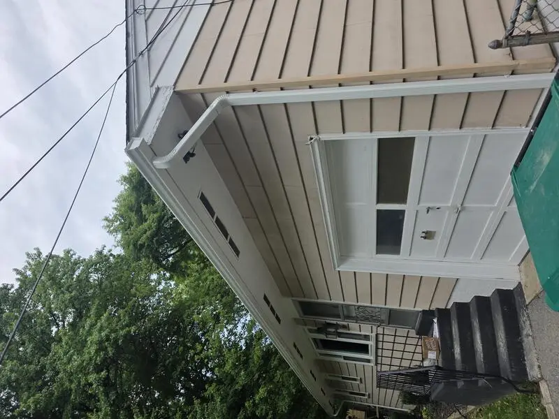 Downspout installed on a garage corner
